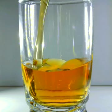 Slo-mo Pouring Super Chilled Liqueur into Shot Glass with Smooth Effect