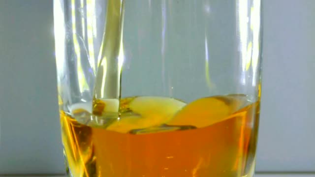 Slo-mo Pouring Super Chilled Liqueur into Shot Glass with Smooth Effect