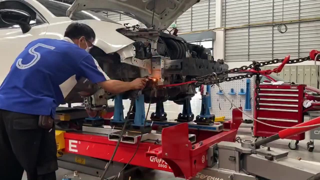 Mazda 3 frame straightening on job repair training with Celette car frame machine and pulling tower