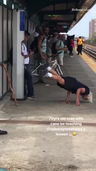Blonde man black shirt hand stand