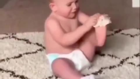 Funny Baby trying to put on stockings