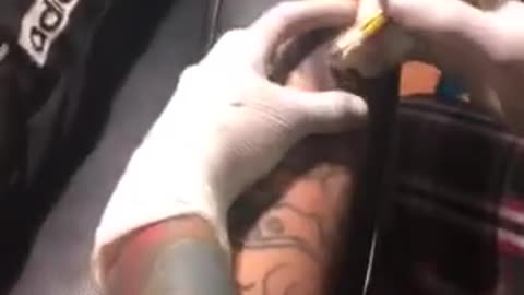 Young people get tattooed