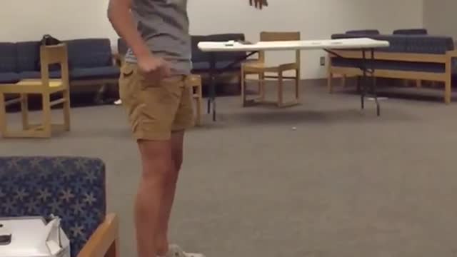 Guy grey shirt doing flip and glasses fall off in slo mo