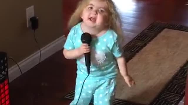 Little girl singing karaoke