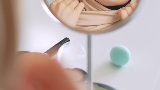 woman-looking-at-herself-in-a-mirror