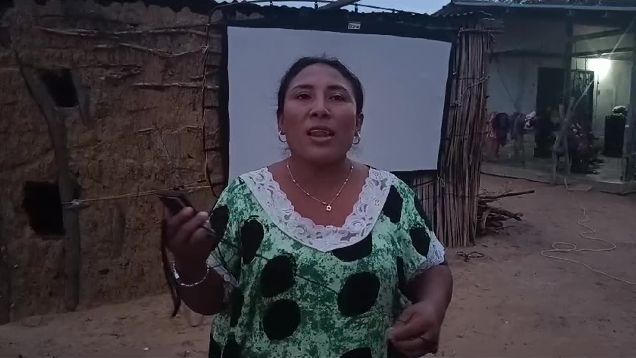 Colombia: Frontline Missions Pastor Arnolfo passing out audio Bible Messengers.