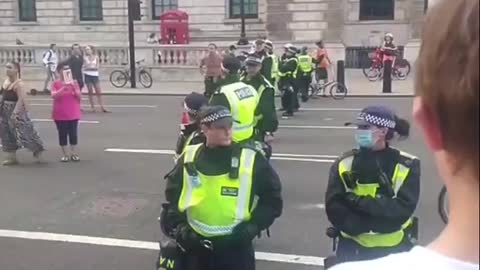 Boy stands tall over police