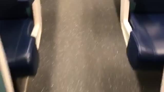 Black harry potter broom in empty seat on subway