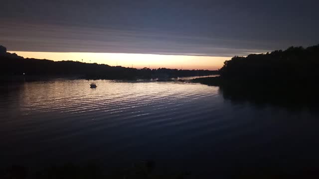 Time-Lapse On The River Bank With A Beautiful Sunset