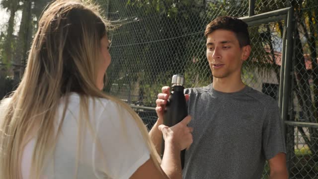 Friends taking a break after a tennis match