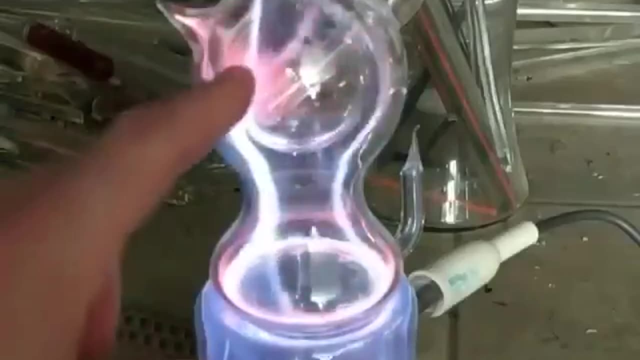 Voltage Applied To A Glass Container W/ Mixture Of Noble Gases Inside~A Plasma Is Formed Within