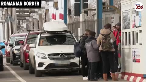 Desperate Ukrainians flee across the border clutching their children