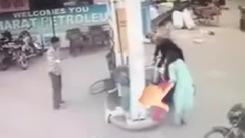 Funny accident by girl at fuel pump