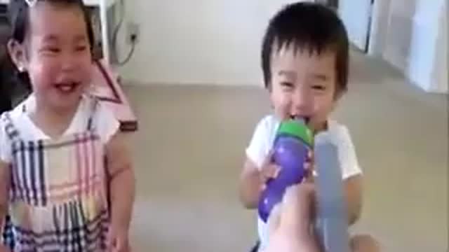 Smiling baby being spray