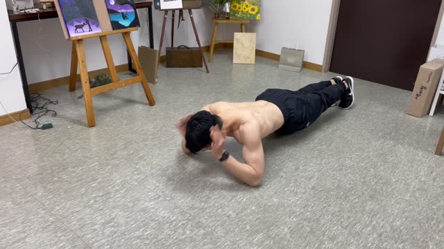 A guy is doing push up.