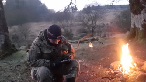 Heating up my Mre meal on a campfire. Riverside wildcamping.