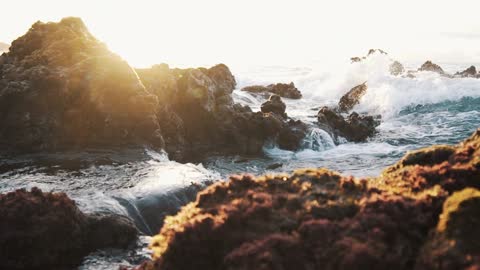 Water Crashing Over The Rocks