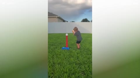 Boy hits dad in the face with ball