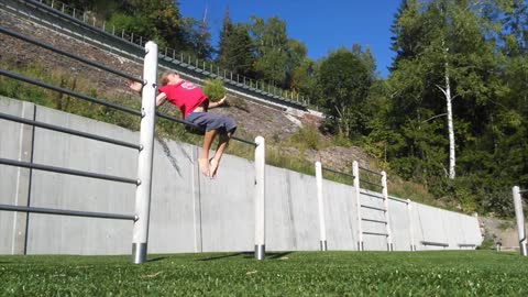 Curly redhead guy flipping on metal pole lands on head