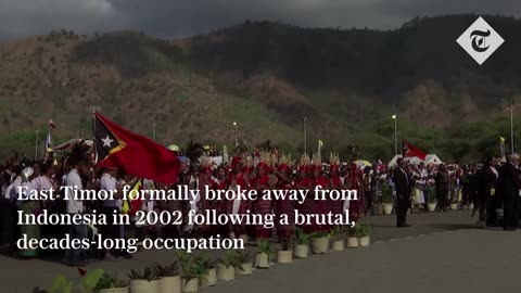 Pope Francis waves from open-topped popemobile as he's welcomed by half of East Timor