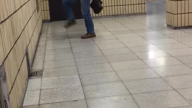 Old guy in suit kicks leg up at wall