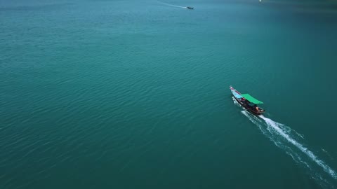 Beautiful peninsula with boats in the water seen from above