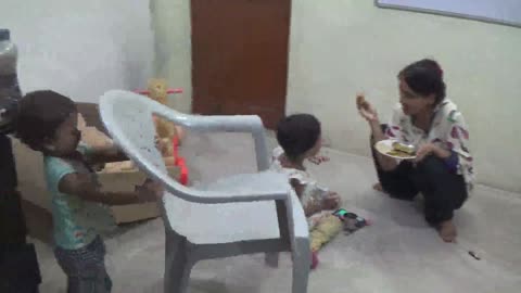Baby Boy is playing with Chair