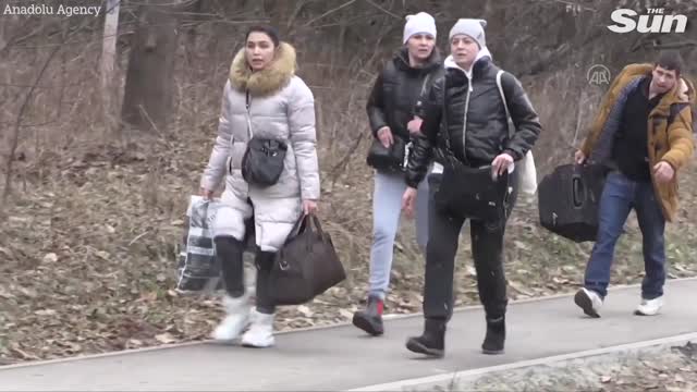 As Russian shelling intensifies in the Ukrainian city of Irpin, residents evacuate.