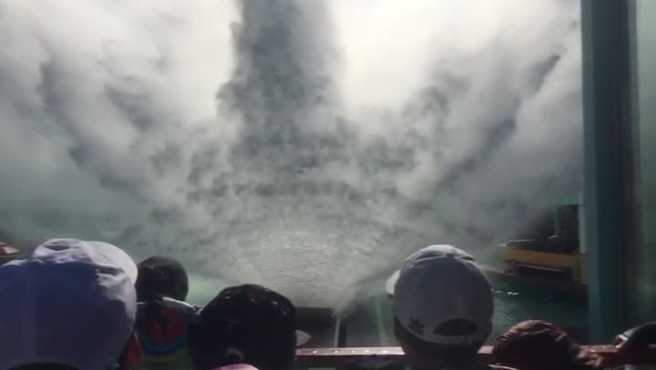 Getting hit by water slide waves at a water park