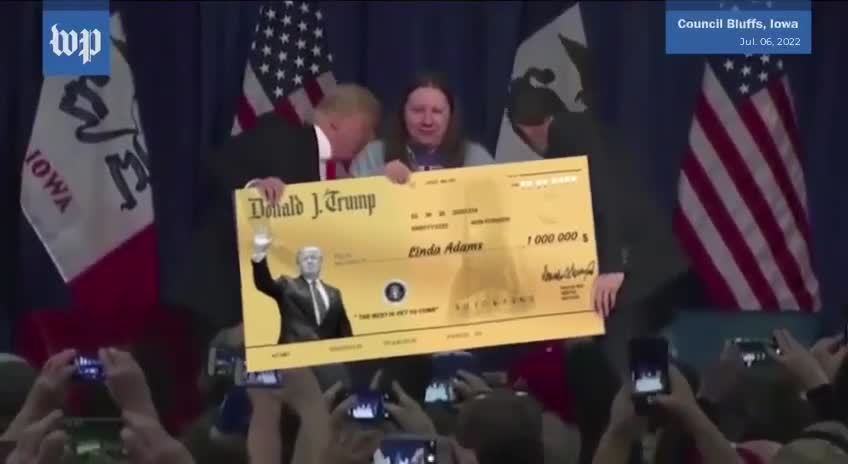 Veteran Linda Adams being rewarded a $1 million dollar Golden Check by President Donald Trump