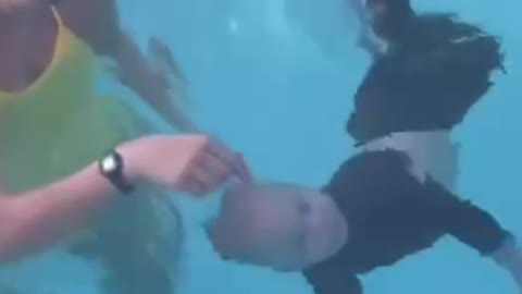 A little baby that can swim