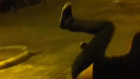 Guy in black shirt jumps on tree branch and breaks it