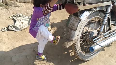 cute baby playing in bike