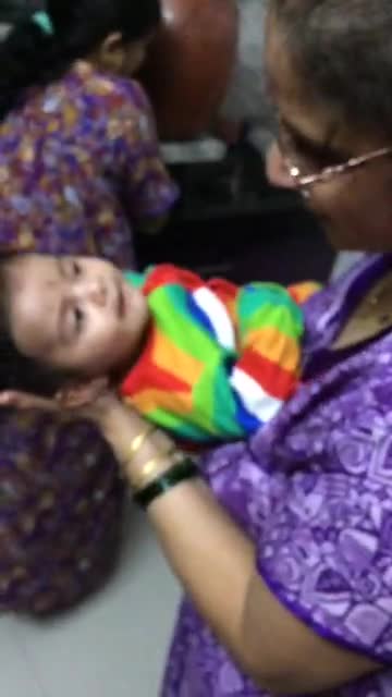 Baby girl responding to a song sung by her grandmother