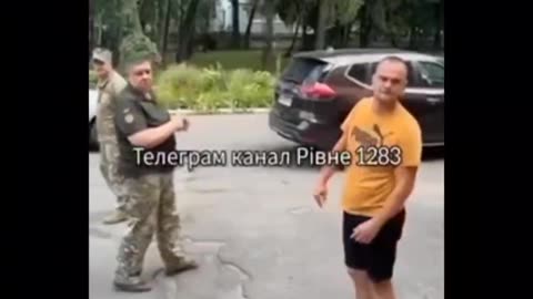 Ukrianian soldiers attempt to conscript man