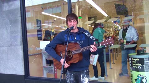 Tim Leay Bassy singe Guitarist. Busking the Ocean City Plymouth 2015