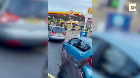 Guy On Horse Chants To People Queueing For Petrol