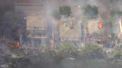 A massive grassfire has caught several homes on fire in Balch Springs