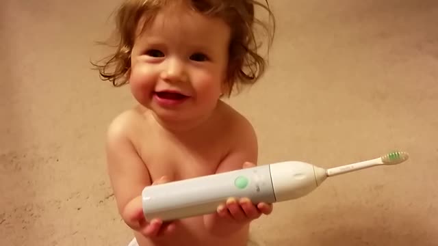 Toddler really enjoys electronic toothbrush