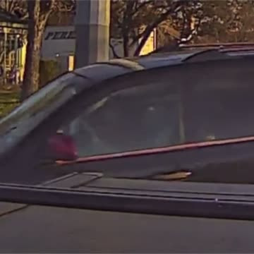 Vehicle Nearly Crashes into Vehicle in Front of Police