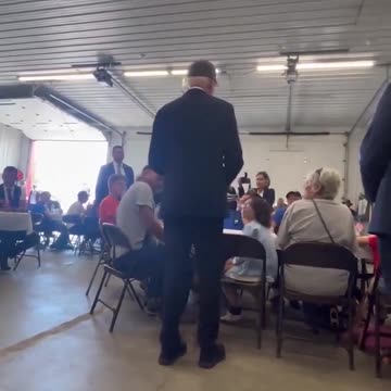 BIDEN WITH TRUMP HAT