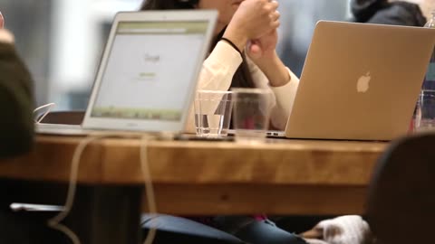 Office Meeting With Macbooks