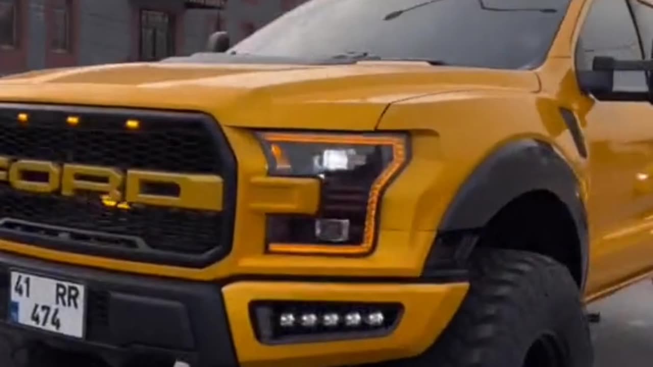 Yellow Ford raptor SUV