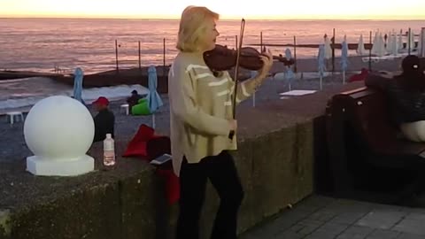 woman beautifully plays the violin