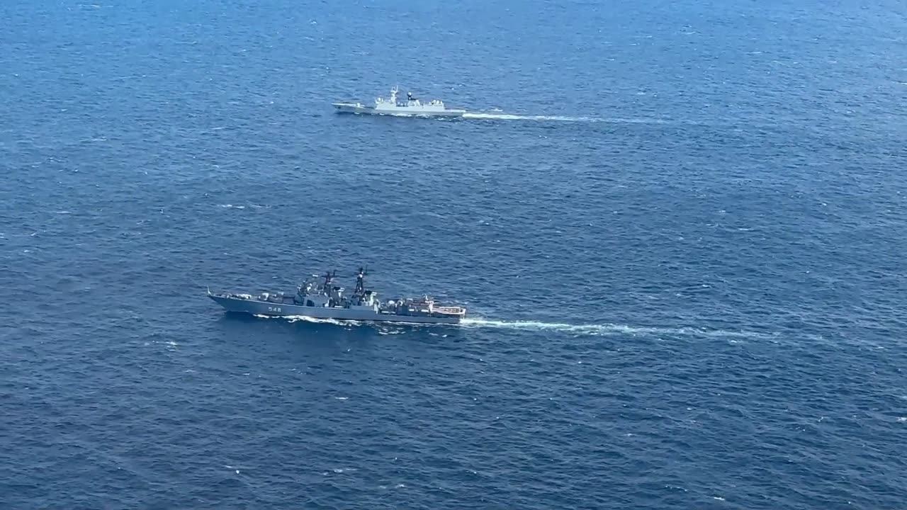 Russian and Chinese warships perform manoeuvring and air defence tasks during naval drills