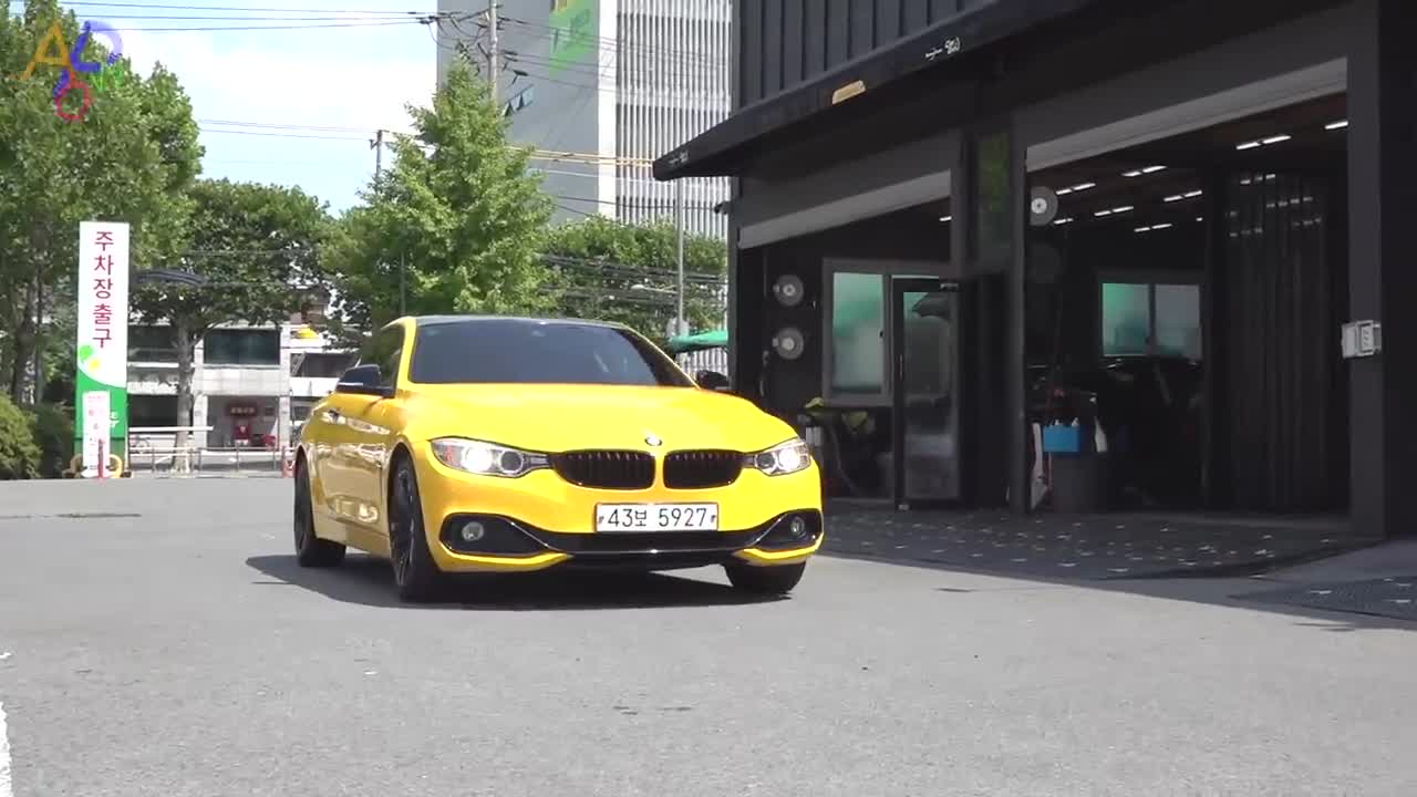 Process Of Turning Old BMW Into New Yellow Car. Korean Car Wrapping Technician