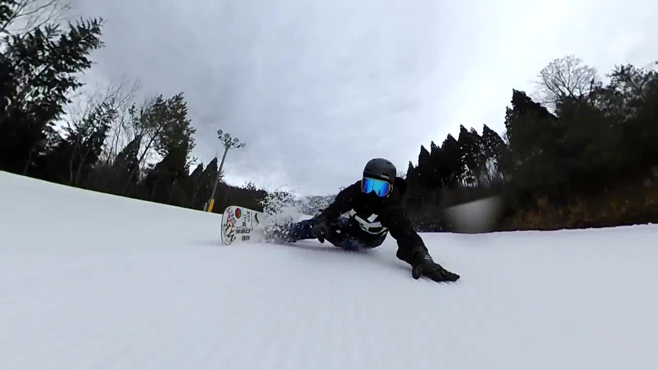 Professional Snowboarder Was Going Smoothly With His Side Body On Snow