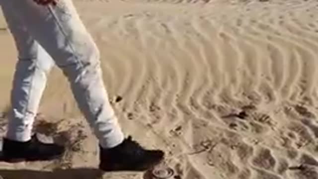 THIS DUDE SEE'S A LANDMINE OUT IN THE DESERT IN SYRIA. SO HE STEPS ON IT TO SEE IF IT IS REAL...