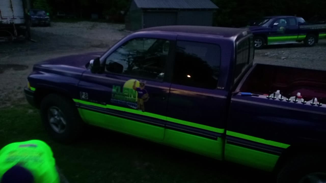 Putting decals on a lawn care truck