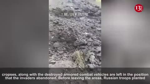 Ukrainian fighters show the equipment and soldiers which they destroyed during the counter-attack